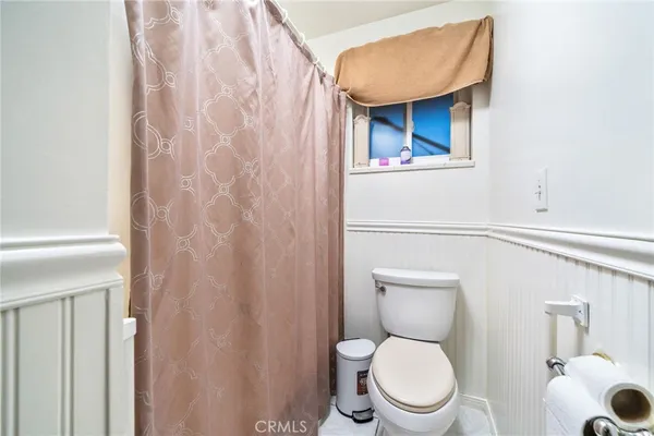 a bathroom with a toilet and a sink