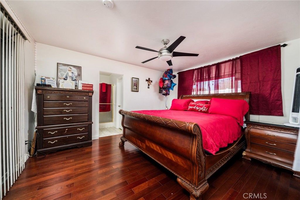 5035 Carlingford Avenue Riverside, CA 92504 - Photo 22 of 32 a bedroom with a bed and wooden floor