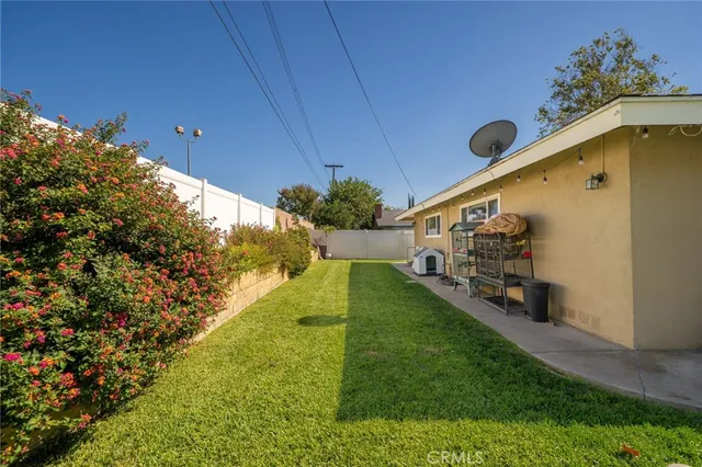 a view of a big yard with potted plants