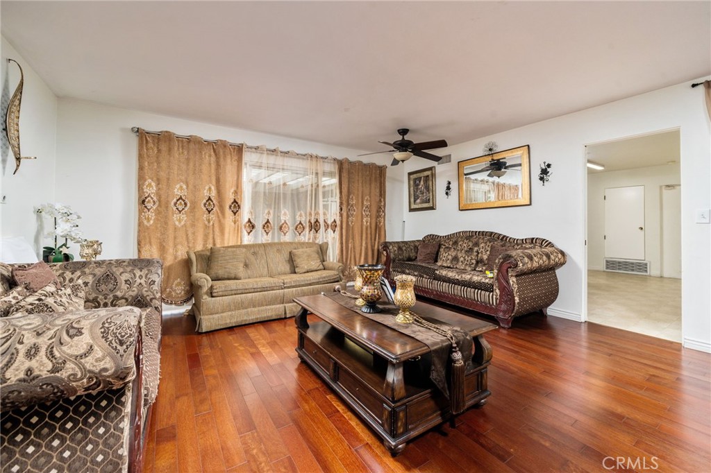 5035 Carlingford Avenue Riverside, CA 92504 - Photo 9 of 32 a living room with furniture and a wooden floor