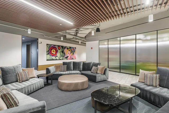 a view of a dining room with furniture and window
