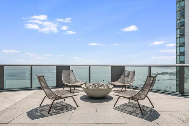 a view of a patio with couches and potted plants