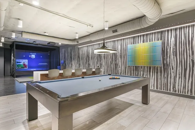 a view of a gym room with gym equipment