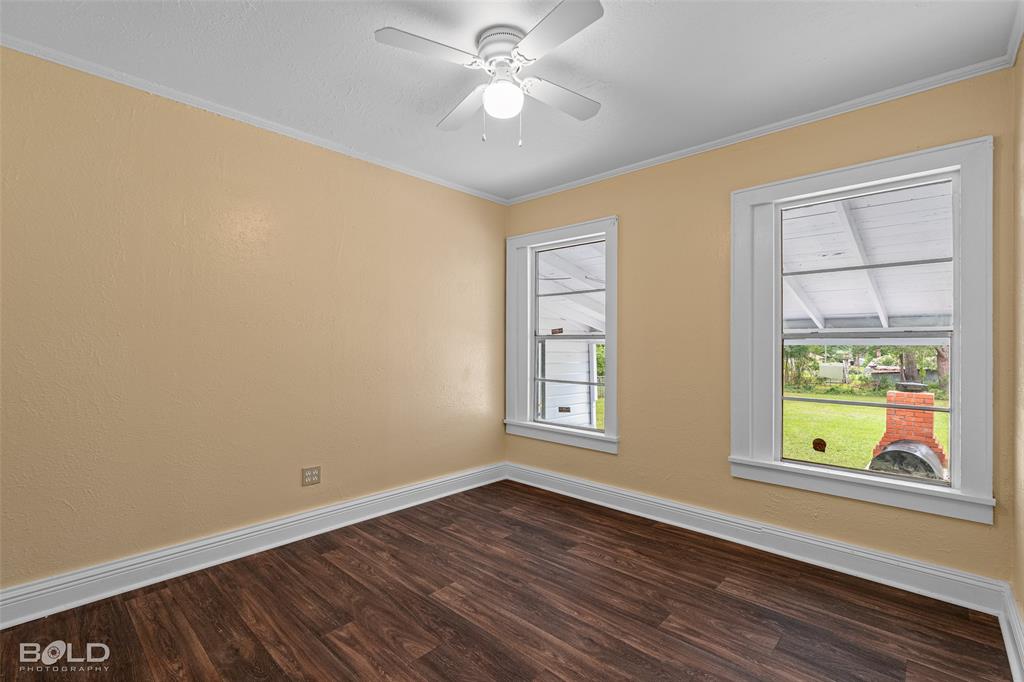 115 Pam Street Mansfield, LA 71052 - Photo 20 of 25 wooden floor in an empty room with a window