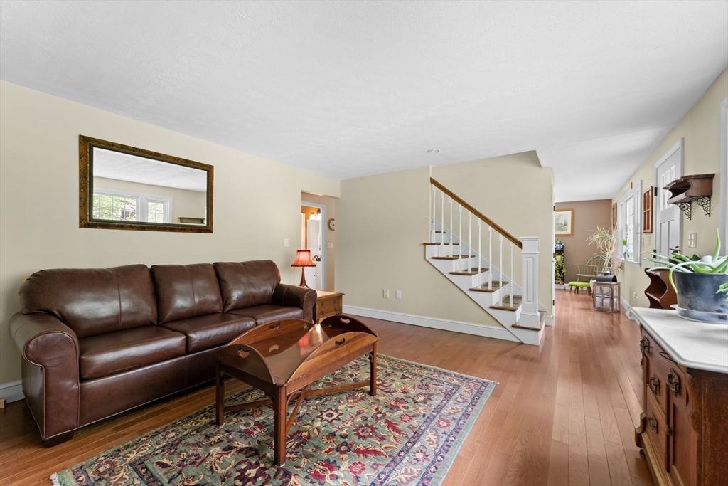 103 Maple Street Plympton, MA 02367 - Photo 11 of 41 a living room with furniture and a wooden floor