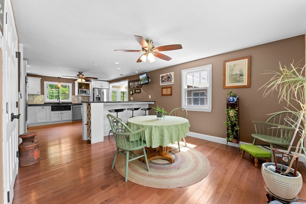 103 Maple Street Plympton, MA 02367 - Photo 13 of 41 a living room with furniture a dining table and a potted plant