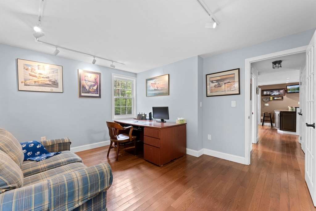 103 Maple Street Plympton, MA 02367 - Photo 18 of 41 a work room with furniture and wooden floor