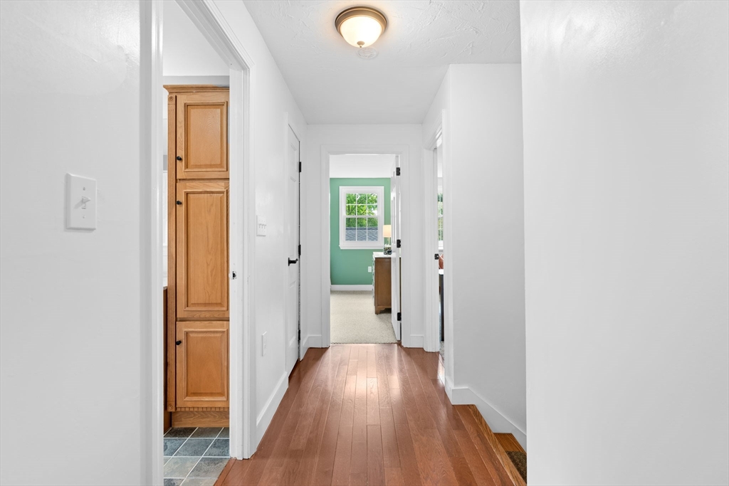 103 Maple Street Plympton, MA 02367 - Photo 21 of 41 a view of a hallway with wooden floor