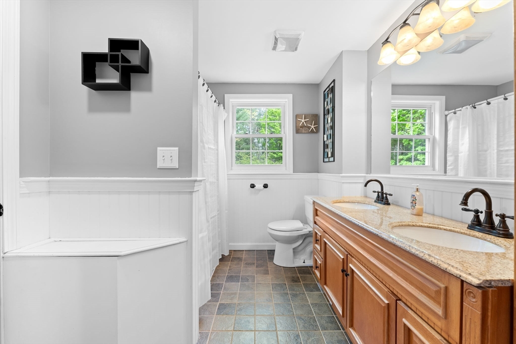 103 Maple Street Plympton, MA 02367 - Photo 29 of 41 a bathroom with a sink a toilet and a bathtub