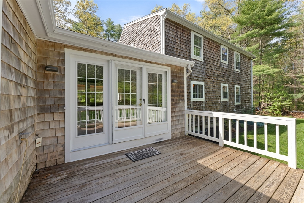 103 Maple Street Plympton, MA 02367 - Photo 36 of 41 a view of a house with a wooden deck