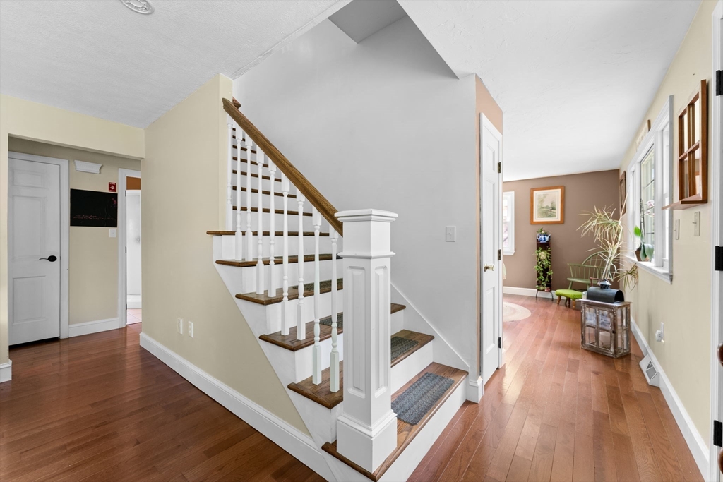 103 Maple Street Plympton, MA 02367 - Photo 8 of 41 a view of entryway livingroom and hall with wooden floor