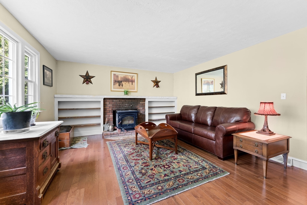 103 Maple Street Plympton, MA 02367 - Photo 9 of 41 a living room with furniture and a fireplace