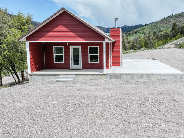 916 North Bonneville Road Preston, ID 83263 - Photo 1 of 37 View of front of property with covered porch and a chimney