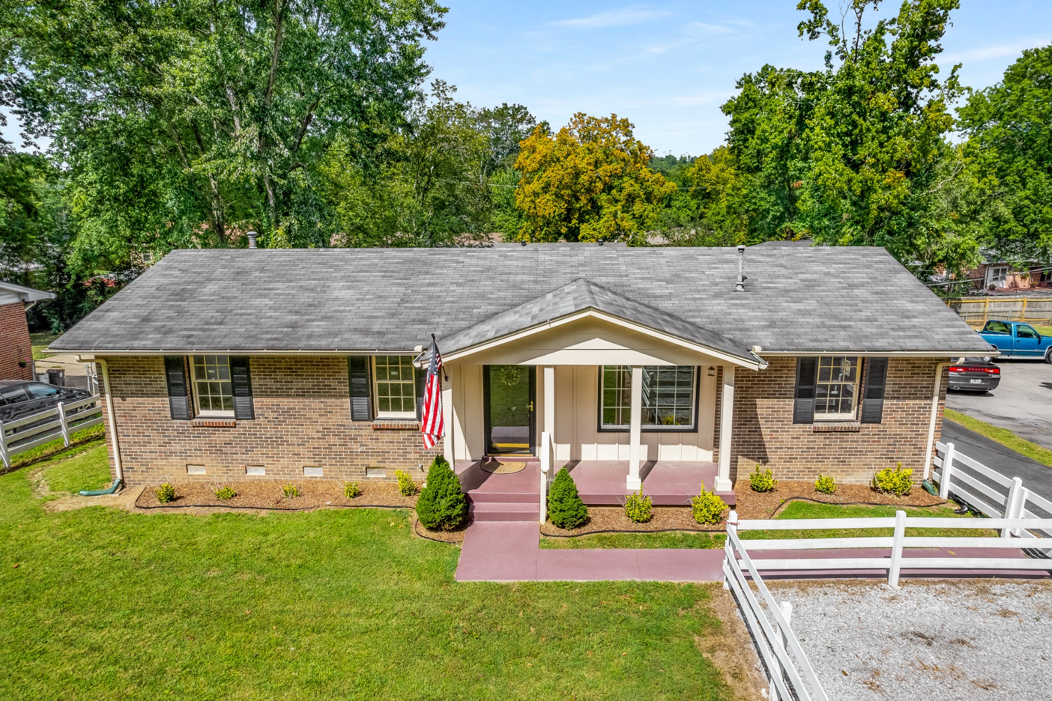 7979 Sawyer Brown Road Nashville, TN 37221 - Photo 1 of 25 aerial view of a house with a yard patio and fire pit