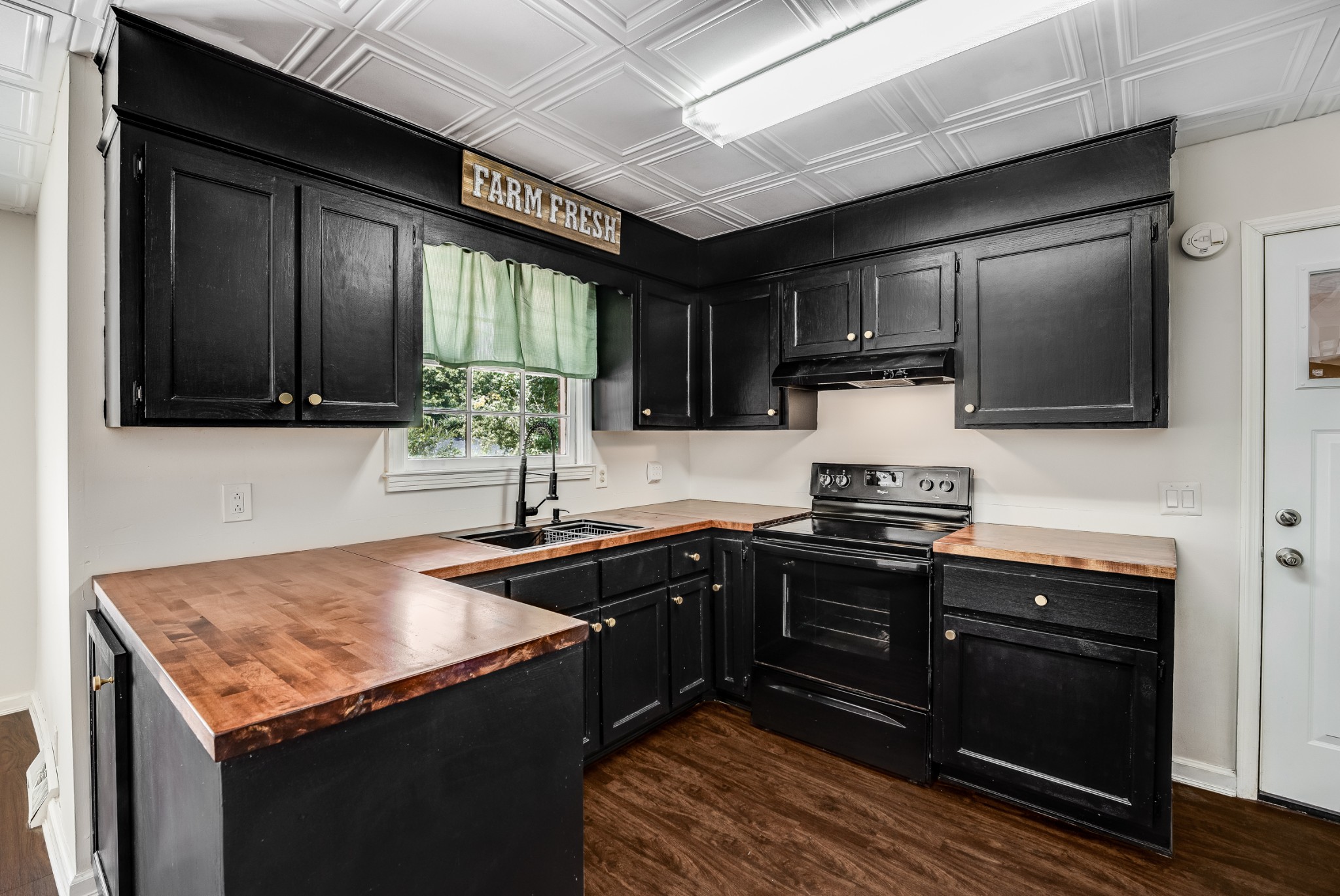 7979 Sawyer Brown Road Nashville, TN 37221 - Photo 12 of 25 a kitchen with a sink stove and microwave