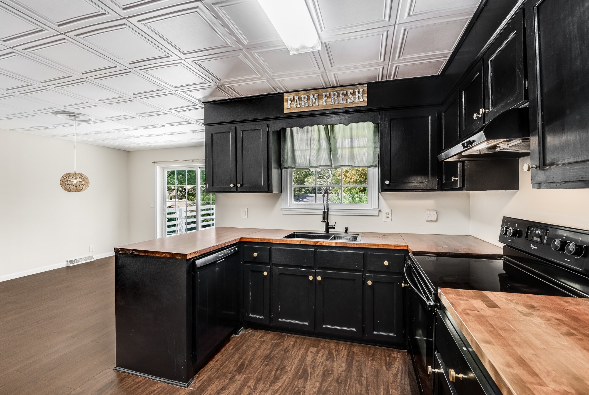7979 Sawyer Brown Road Nashville, TN 37221 - Photo 13 of 25 a kitchen with stainless steel appliances a sink stove and cabinets