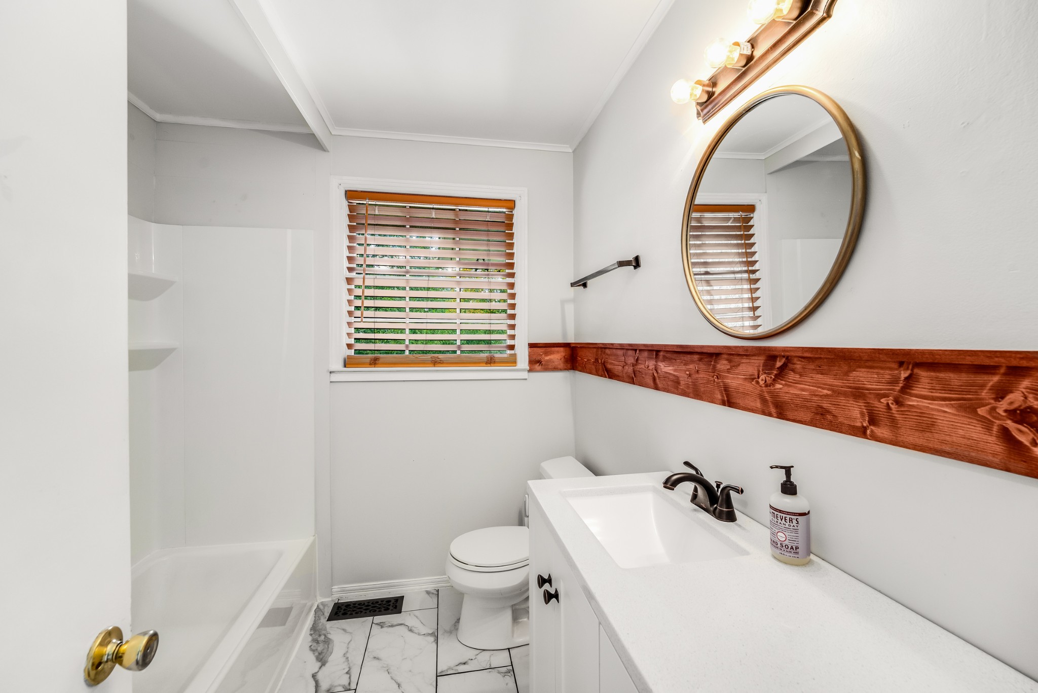 7979 Sawyer Brown Road Nashville, TN 37221 - Photo 15 of 25 a bathroom with a sink and a mirror