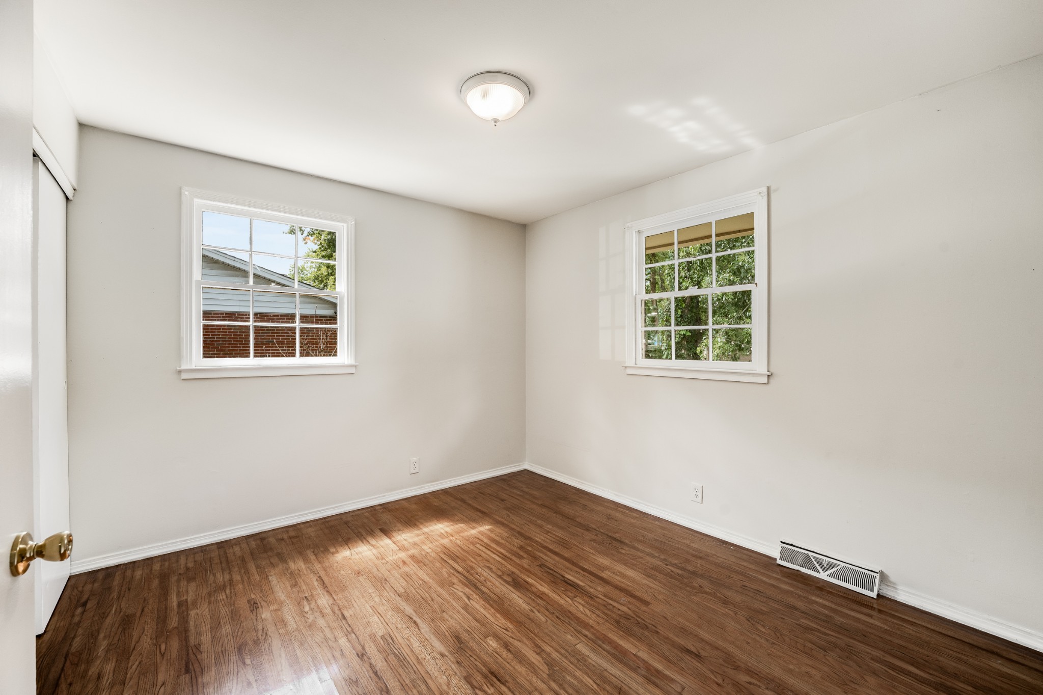 7979 Sawyer Brown Road Nashville, TN 37221 - Photo 17 of 25 a view of empty room with wooden floor and fan