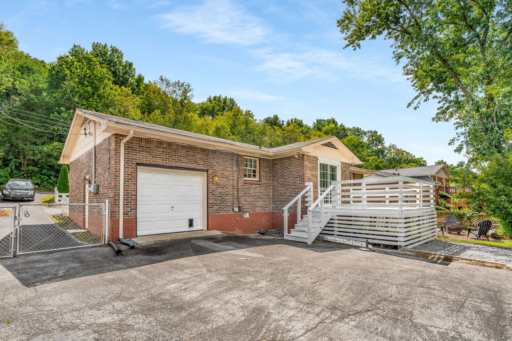 7979 Sawyer Brown Road Nashville, TN 37221 - Photo 20 of 25 a view of a house with a garage
