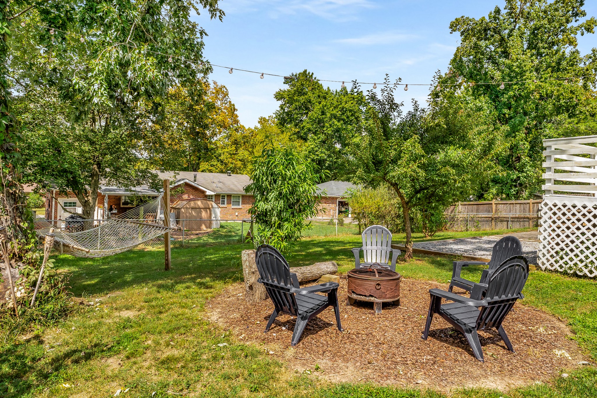7979 Sawyer Brown Road Nashville, TN 37221 - Photo 2 of 25 a view of a chairs and table in backyard