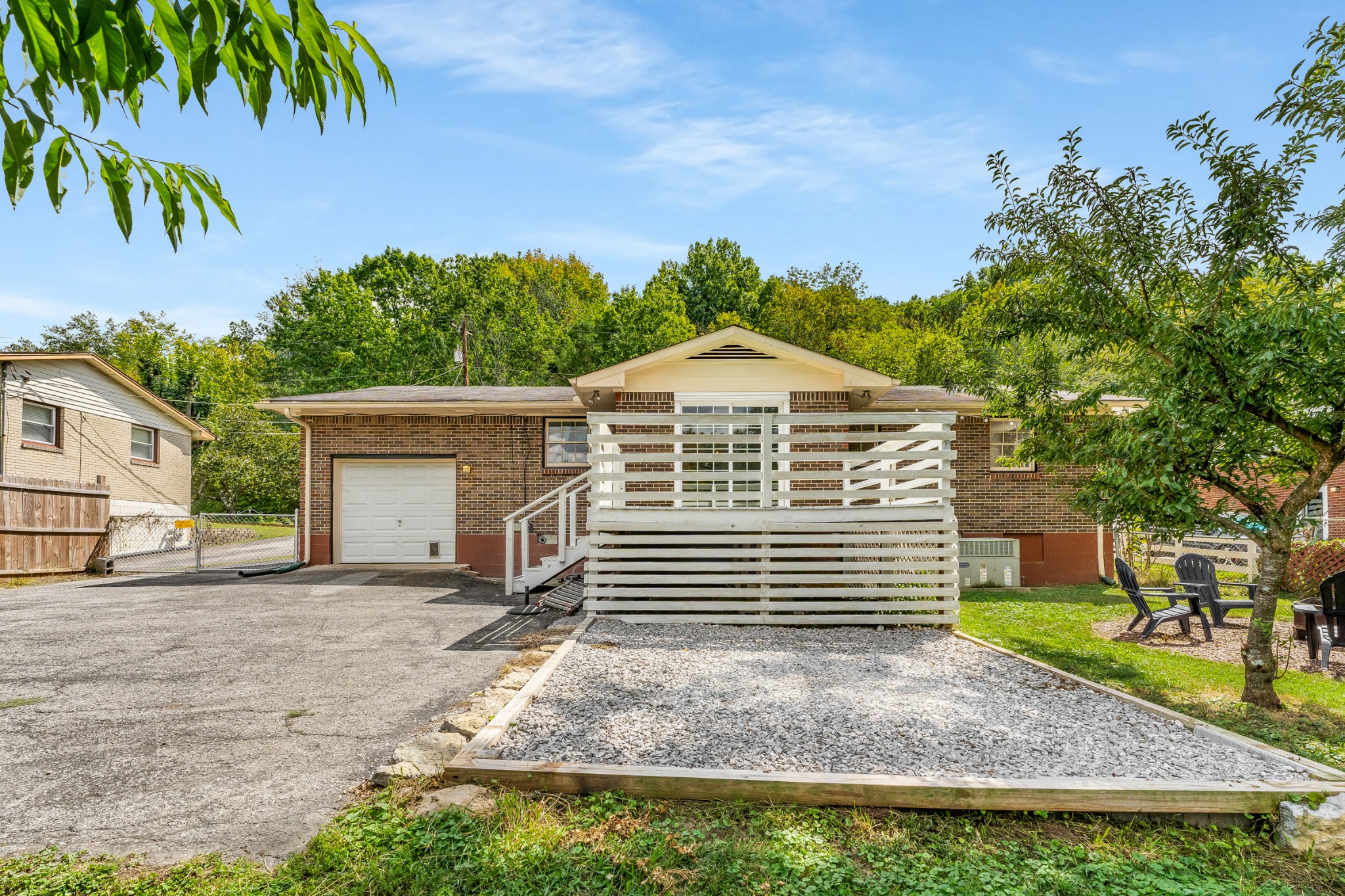 7979 Sawyer Brown Road Nashville, TN 37221 - Photo 21 of 25 a front view of a house with a garden