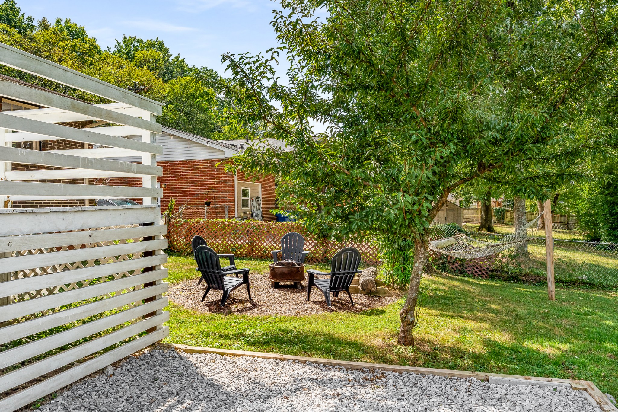 7979 Sawyer Brown Road Nashville, TN 37221 - Photo 22 of 25 a view of a house with backyard porch and sitting area