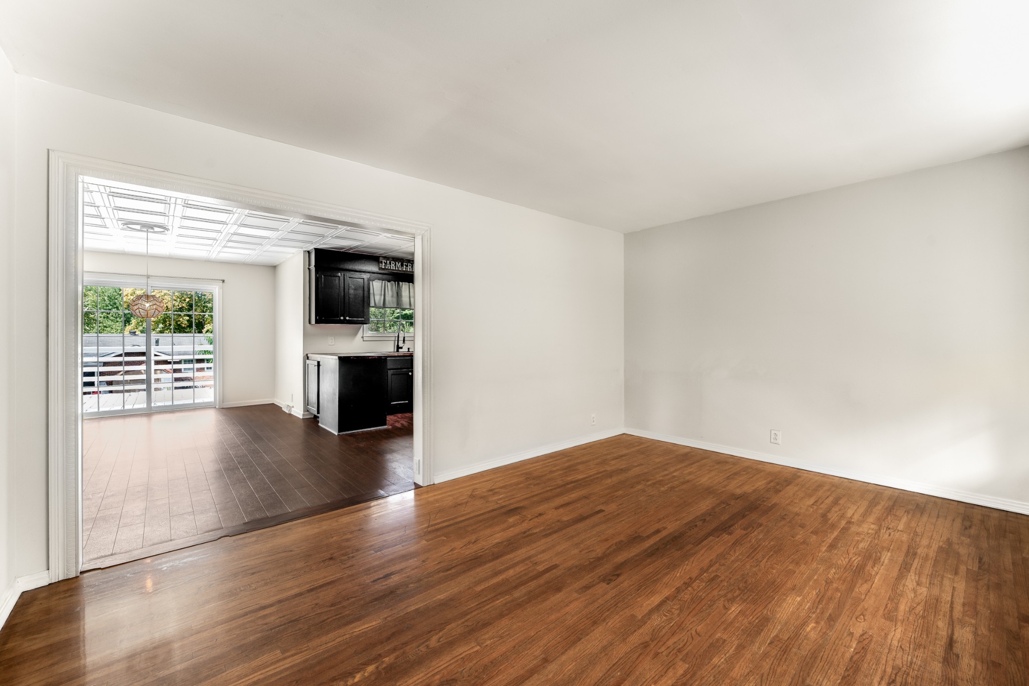 7979 Sawyer Brown Road Nashville, TN 37221 - Photo 8 of 25 a view of empty room with wooden floor and fireplace