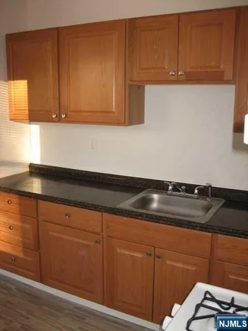 a close view of sink and cabinets