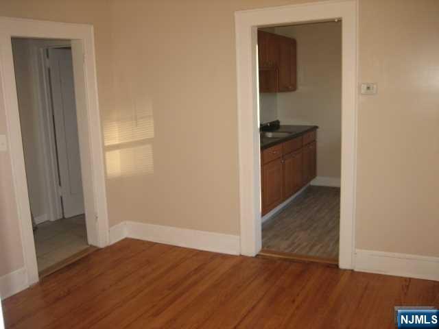 75 Barkley Avenue, Unit 4 Clifton, NJ 07011 - Photo 3 of 10 a view of a kitchen from the hallway