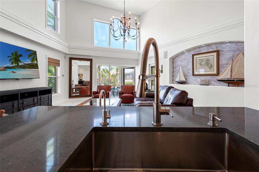 6315 Marbella Boulevard Apollo Beach, FL 33572 - Photo 20 of 83 a view of living room with furniture and chandelier