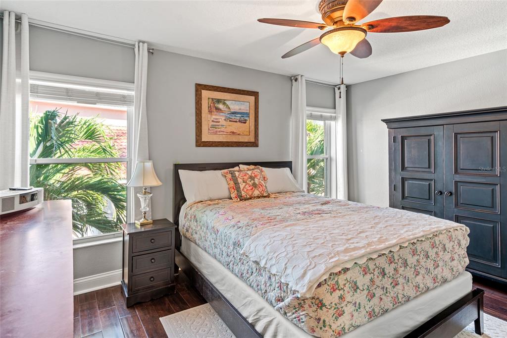 6315 Marbella Boulevard Apollo Beach, FL 33572 - Photo 36 of 83 a bedroom with a bed and a chandelier