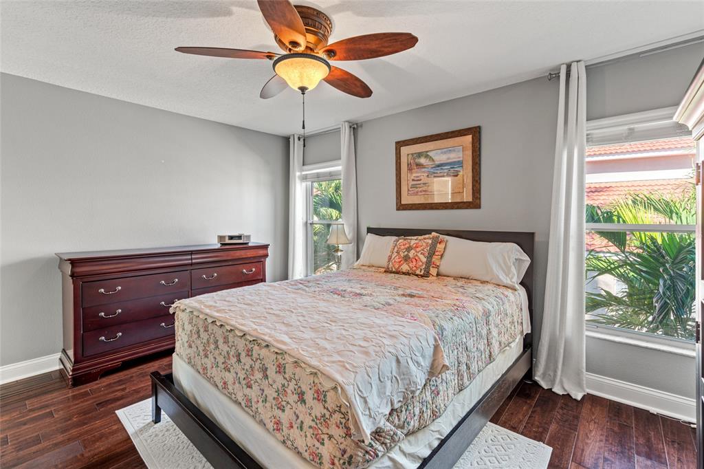 6315 Marbella Boulevard Apollo Beach, FL 33572 - Photo 37 of 83 a bedroom with a bed and a chandelier