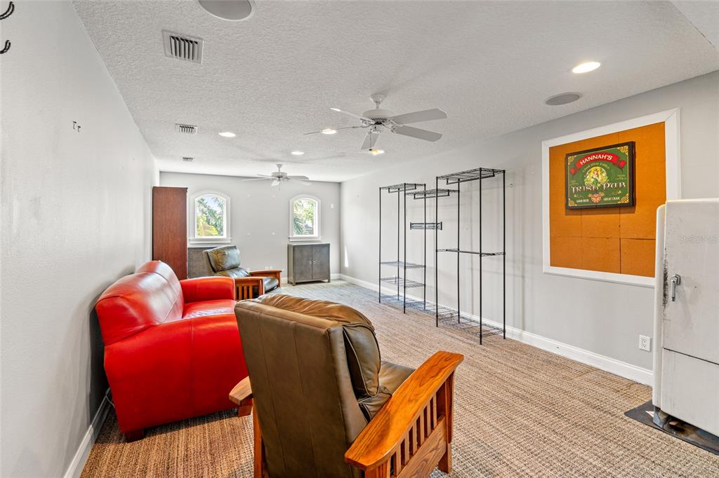 6315 Marbella Boulevard Apollo Beach, FL 33572 - Photo 40 of 83 a living room with furniture a large window and wooden floor