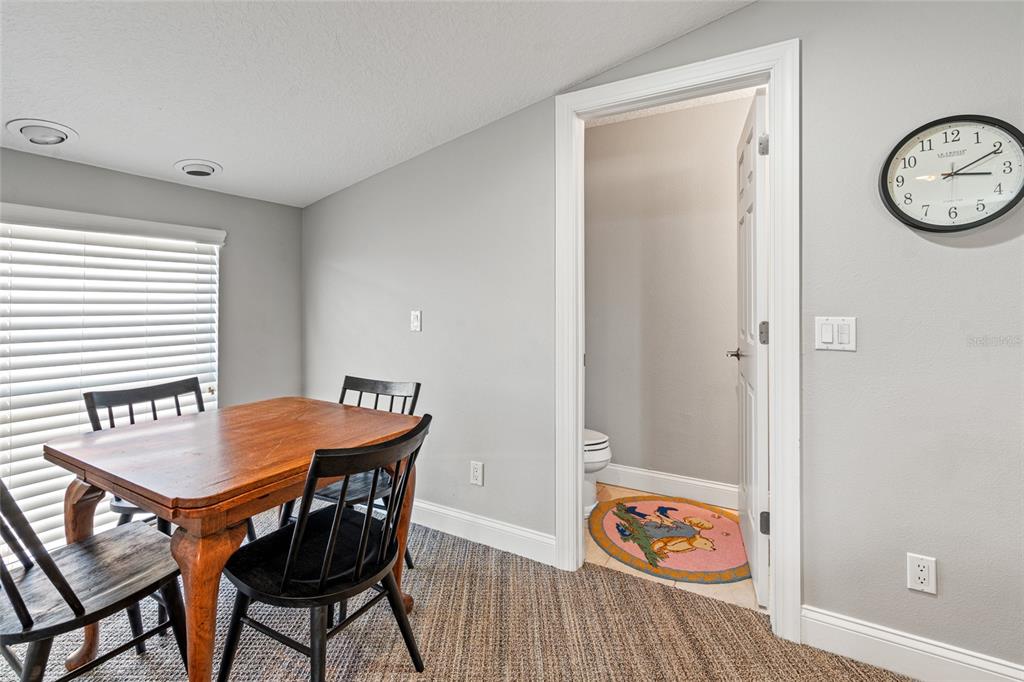 6315 Marbella Boulevard Apollo Beach, FL 33572 - Photo 41 of 83 a view of a dining area with furniture and wooden floor