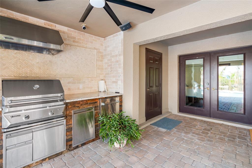 6315 Marbella Boulevard Apollo Beach, FL 33572 - Photo 43 of 83 a kitchen with a stove and a refrigerator