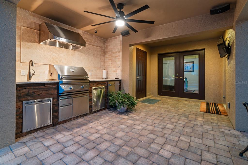 6315 Marbella Boulevard Apollo Beach, FL 33572 - Photo 45 of 83 a kitchen with stainless steel appliances granite countertop a stove a sink and a refrigerator