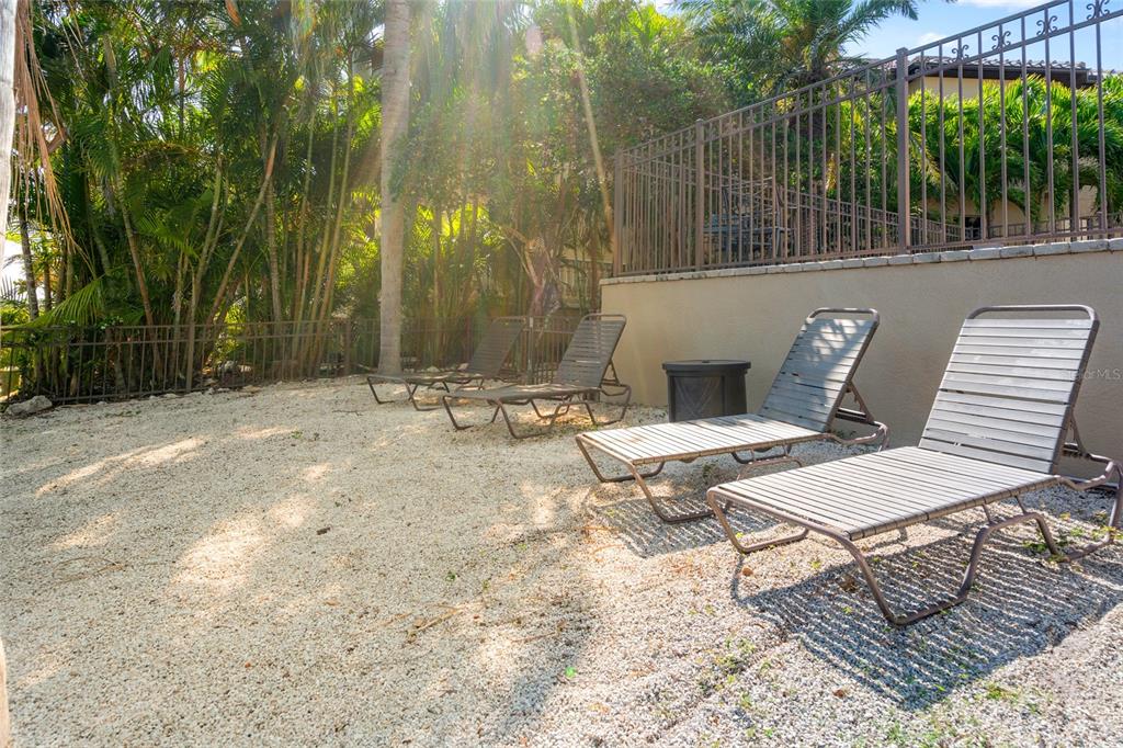 6315 Marbella Boulevard Apollo Beach, FL 33572 - Photo 56 of 83 a backyard of a house with table and chairs