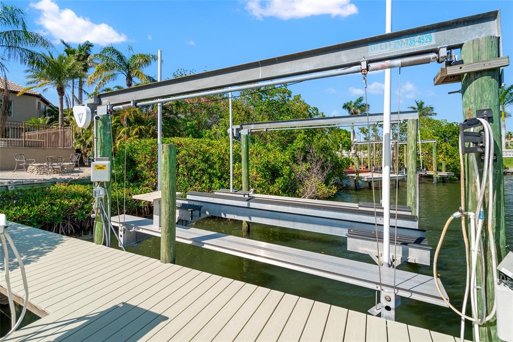 6315 Marbella Boulevard Apollo Beach, FL 33572 - Photo 62 of 83 a view of a deck with a table and chairs next to a yard