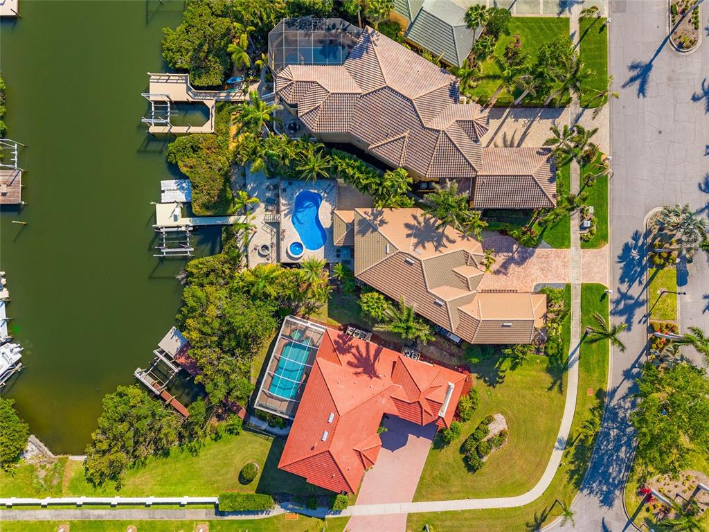 6315 Marbella Boulevard Apollo Beach, FL 33572 - Photo 69 of 83 an aerial view of a house with a swimming pool outdoor seating and yard