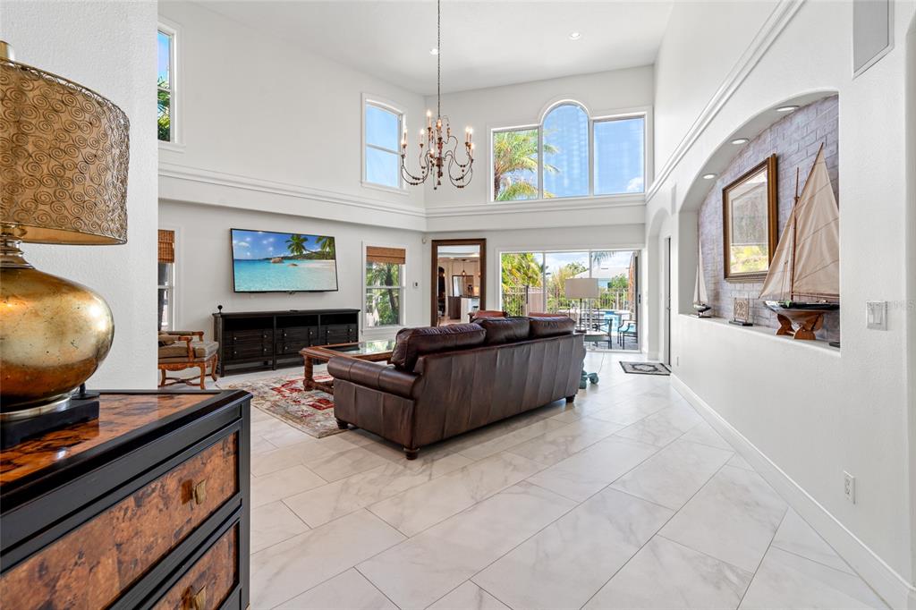 6315 Marbella Boulevard Apollo Beach, FL 33572 - Photo 8 of 83 a living room with furniture and a flat screen tv