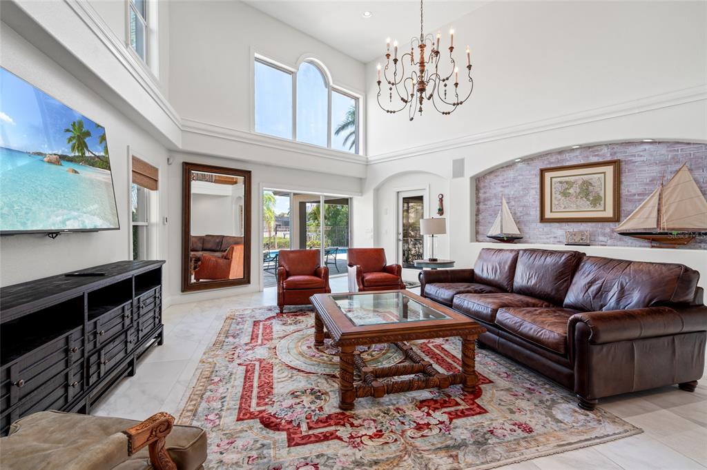 6315 Marbella Boulevard Apollo Beach, FL 33572 - Photo 9 of 83 a living room with furniture and a kitchen view