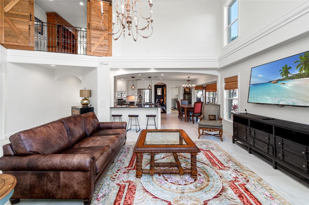 6315 Marbella Boulevard Apollo Beach, FL 33572 - Photo 10 of 83 a living room with furniture and a flat screen tv