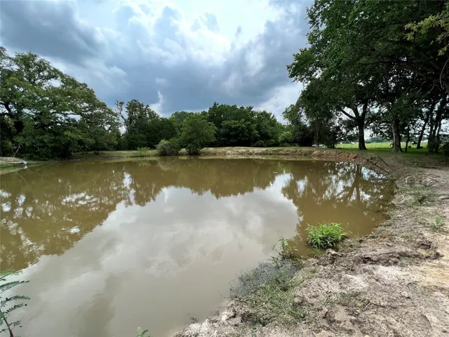 a view of outdoor space with deck and yard