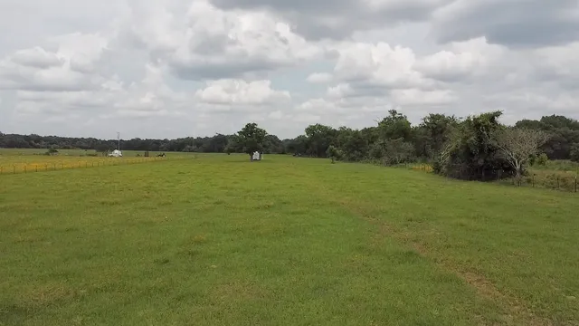a view of a lake with a big yard