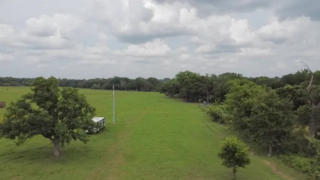 a view of a lake with houses in the back