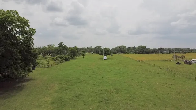 a wooden bench sitting in the middle of a lake