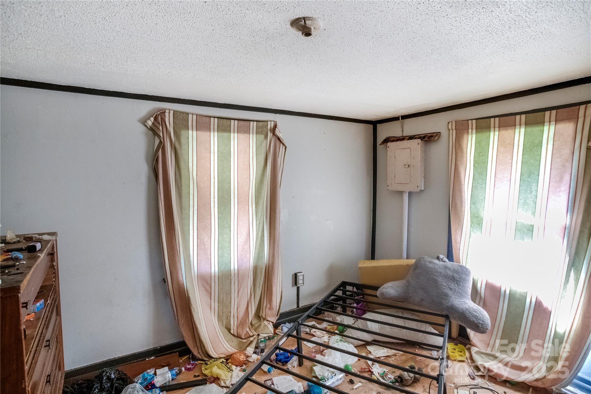 401 Ray Street Waynesville, NC 28786 - Photo 5 of 10 a bedroom with a bed and a window