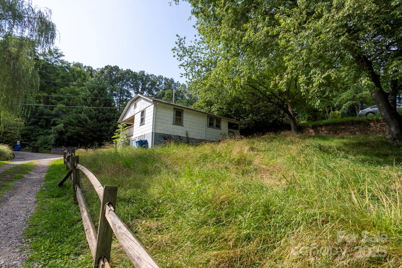 401 Ray Street Waynesville, NC 28786 - Photo 10 of 10 a backyard of a house with lots of green space