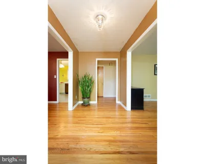 a view of an entryway with kitchen