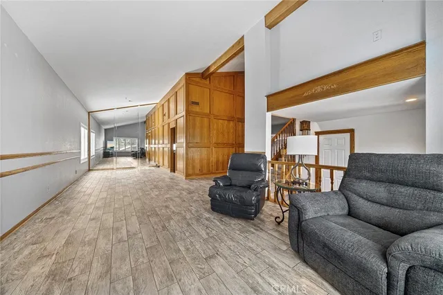 a bedroom with a bed and a television